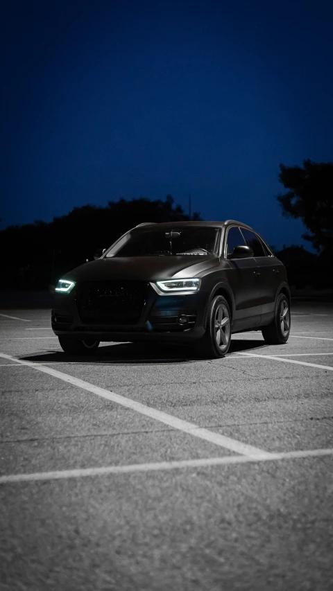 an suv parked in a parking lot at night