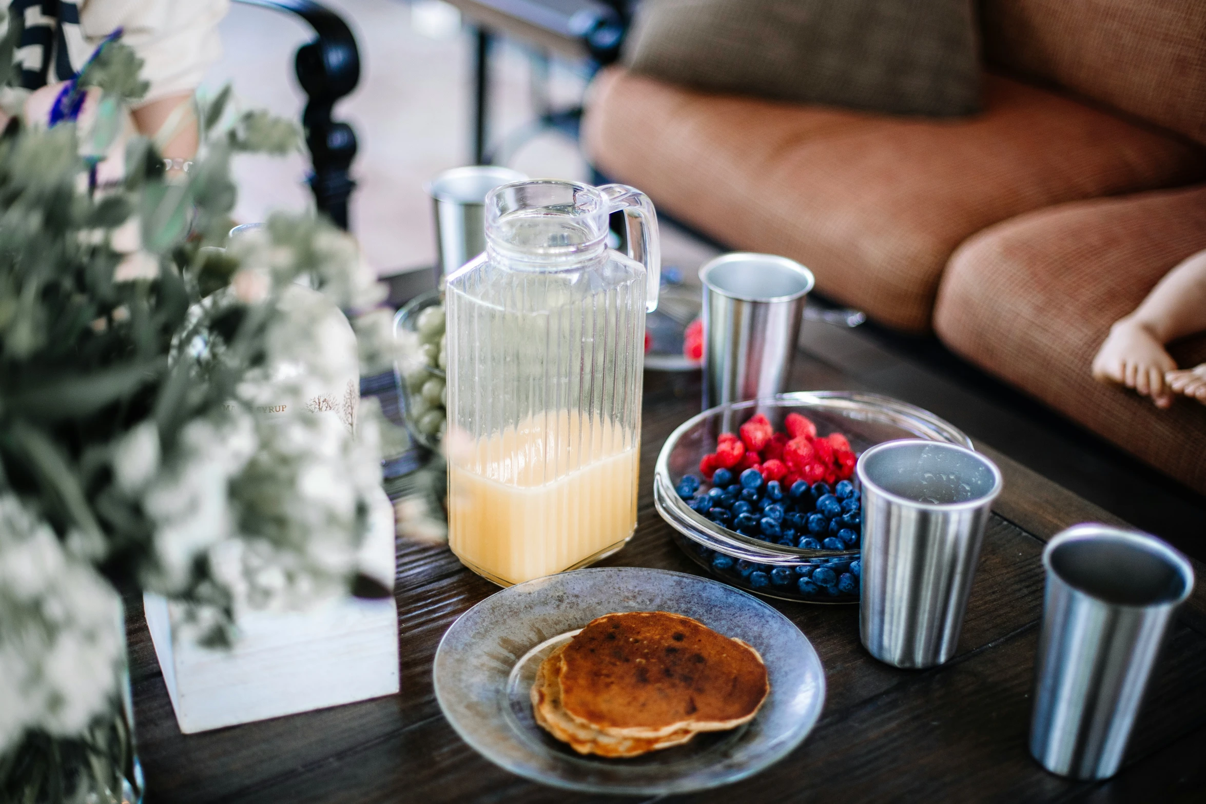 a plate topped with pancakes next to a drink