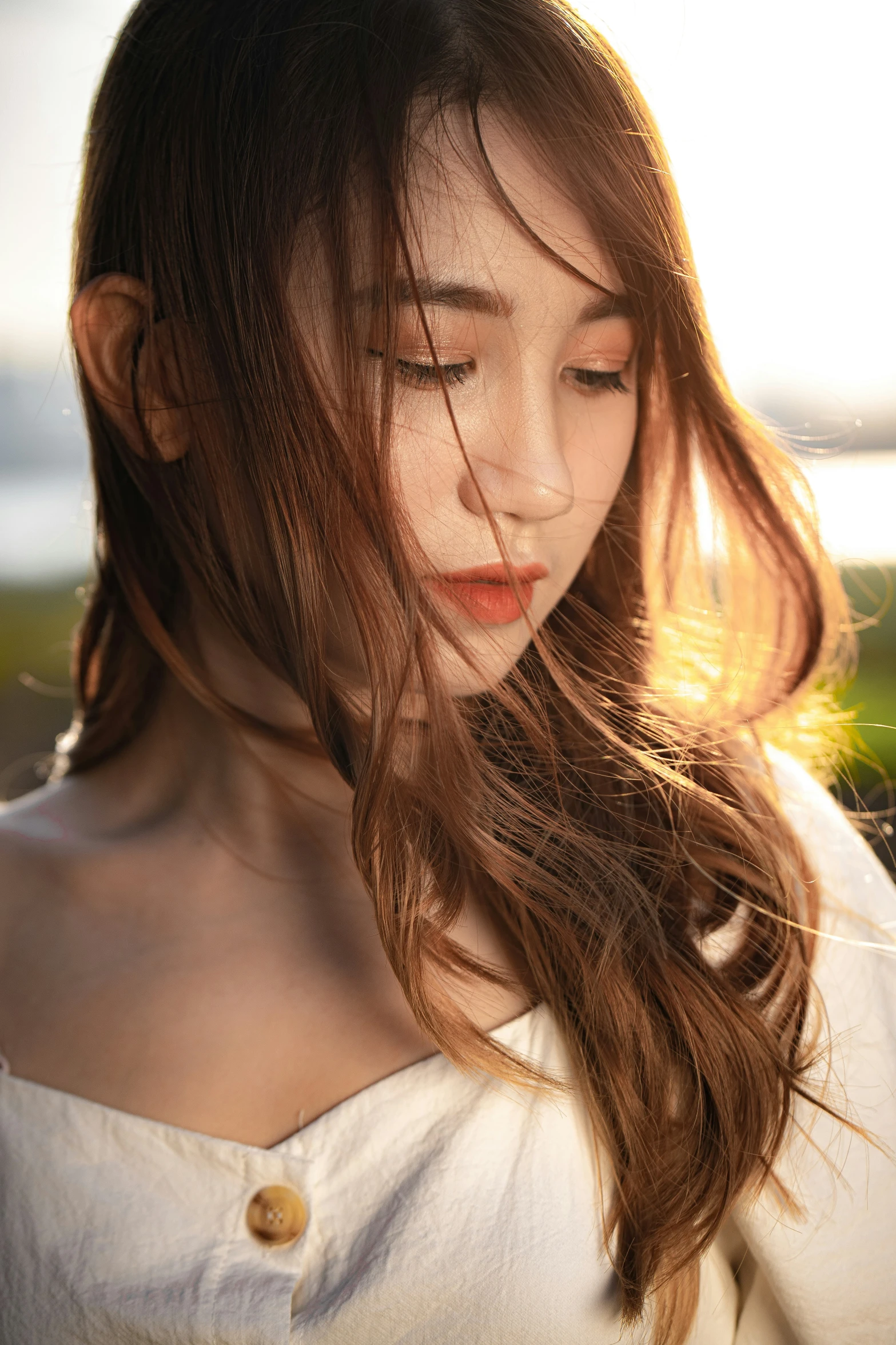 a woman with long hair and white dress on