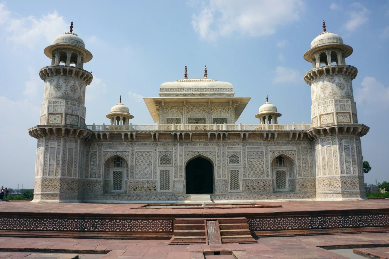 an ornate white building with two large towers