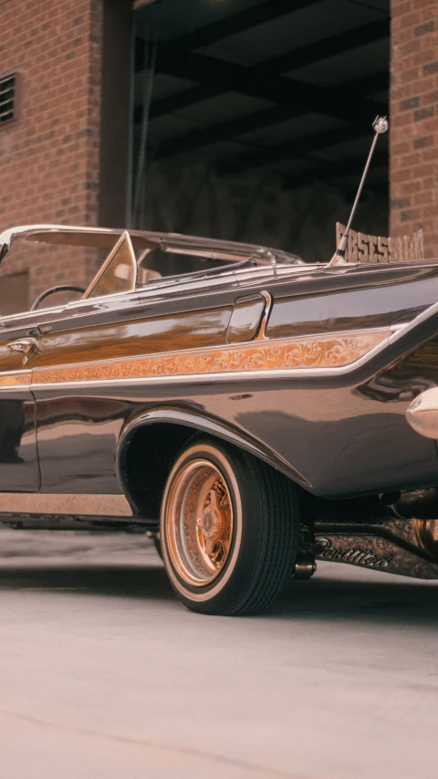 an older style car with a nice brown paint job