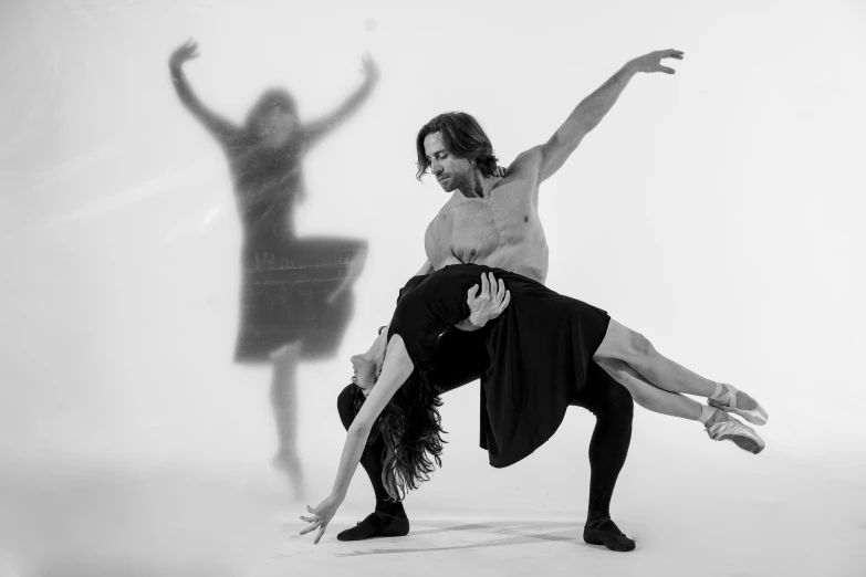 two dancers performing in an artistic po shoot