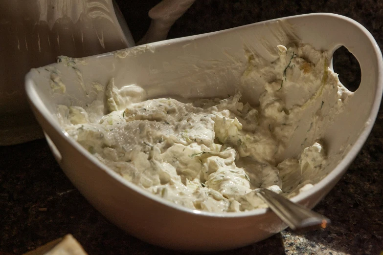 a dish filled with mashed potatoes on top of a table