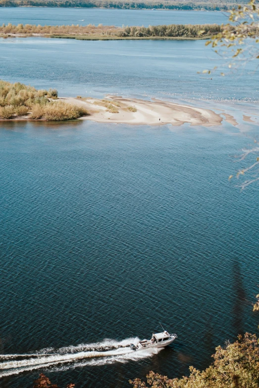 a large body of water with a boat floating on top of it