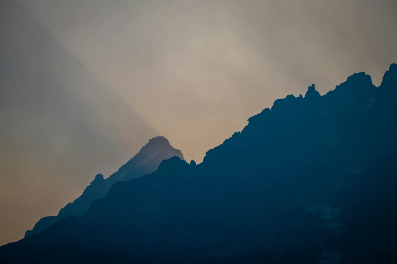 a view of the mountains from across the lake