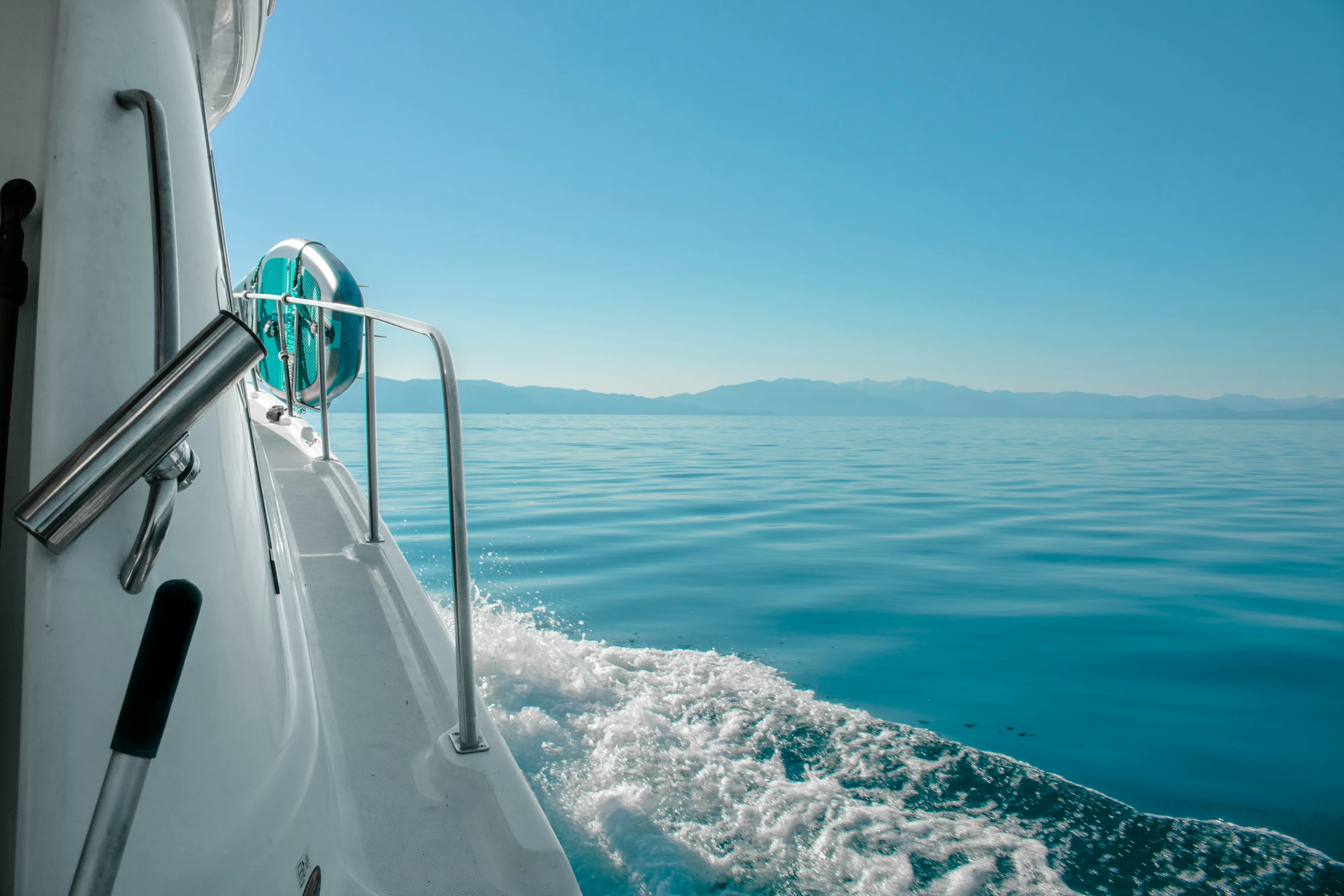 a boat's front bow traveling across the water