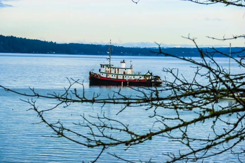 a large boat sits in a body of water