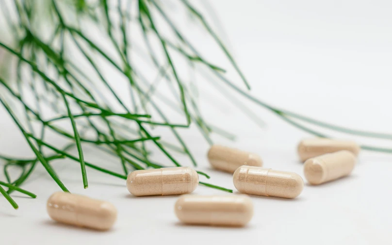 a close up of some pills laying on a table