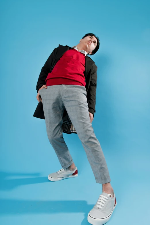 a man in an over - sized t - shirt is in mid air