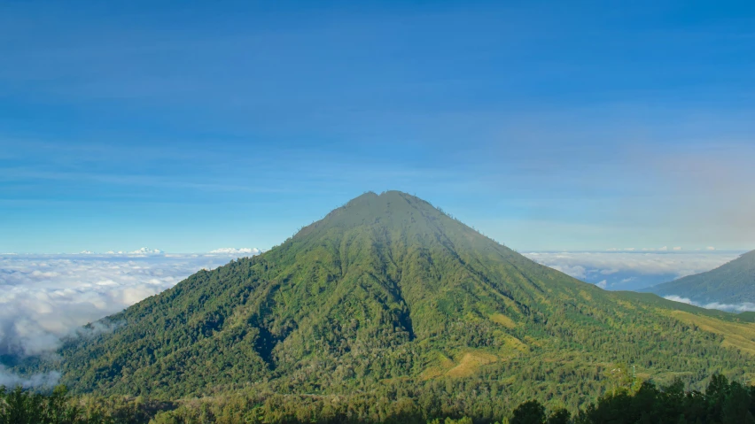 mountains rise above the clouds and provide a majestic view