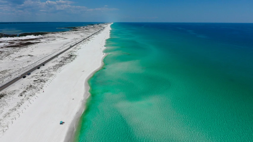 a beach along a road is shown in this image