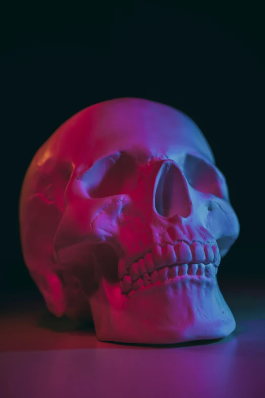 a multi - colored skull glows on the table