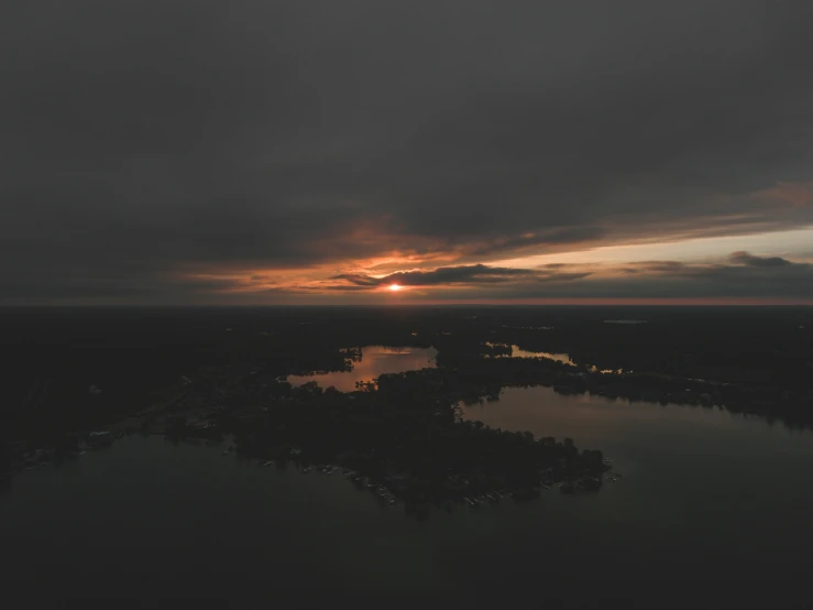 the sunset at a large lake in the middle of the night