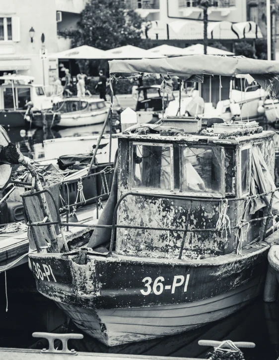 this is a boat in a harbor and it has people in it