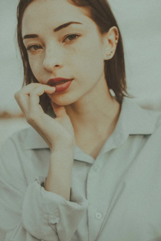 a woman in a shirt and white collared shirt