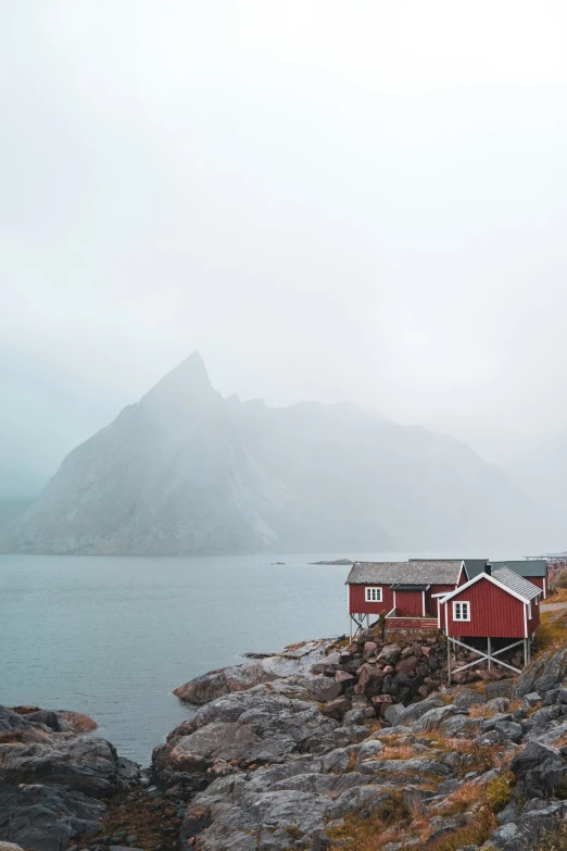 an image of some buildings that are by the water