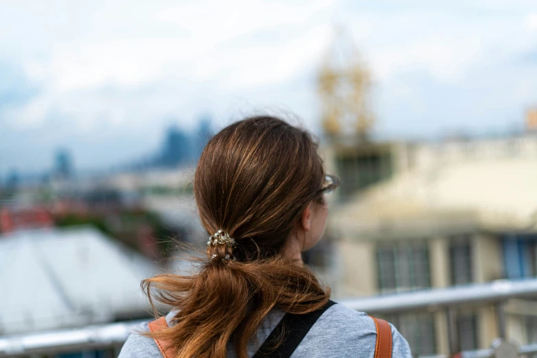 woman with her back to camera taking pictures