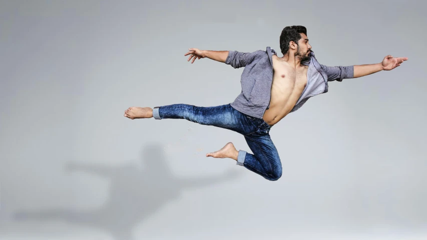 a man in mid air doing somersage