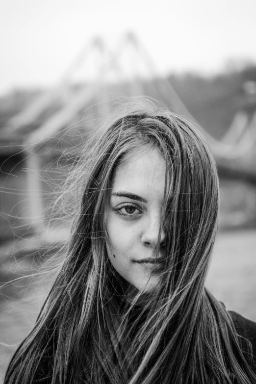 the girl with long hair is posing for a picture