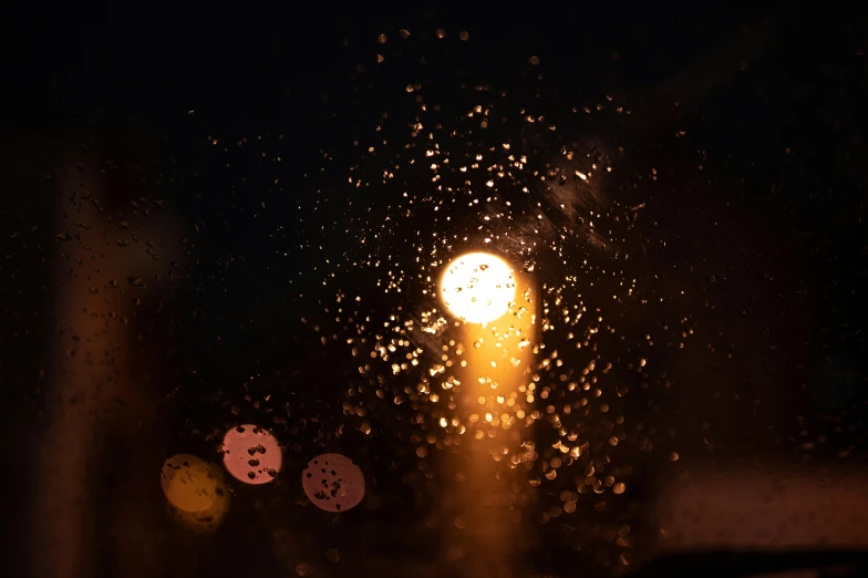 rain falling from a street light in the night