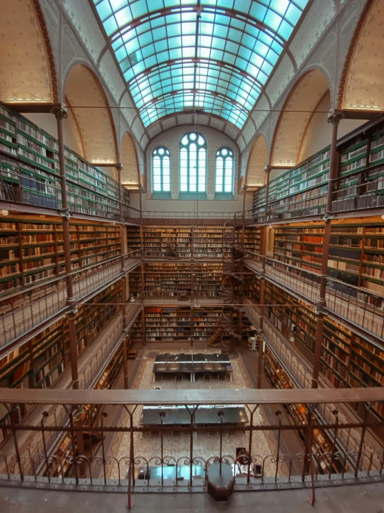 an old liry with bookshelves and tables