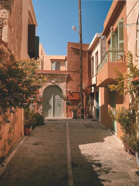 the front door is painted pink and the front of a house is white