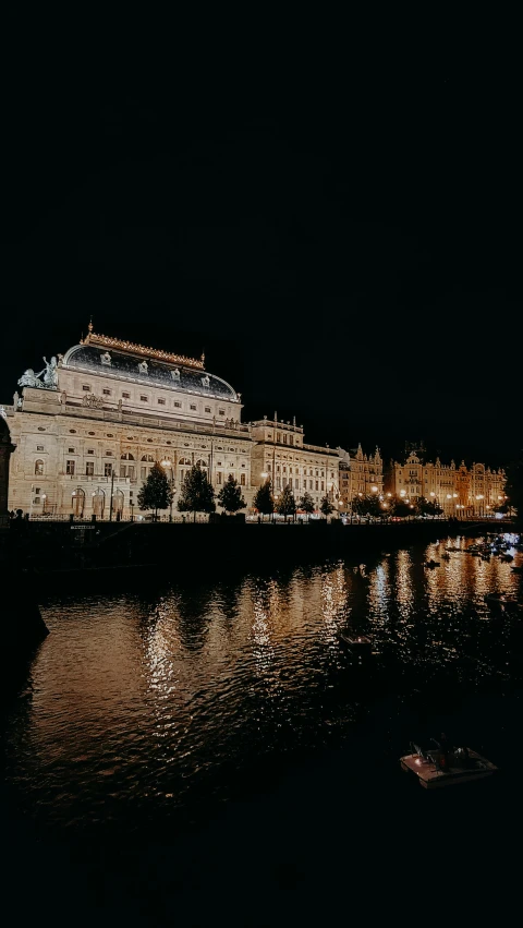 a large building that is sitting on the side of water