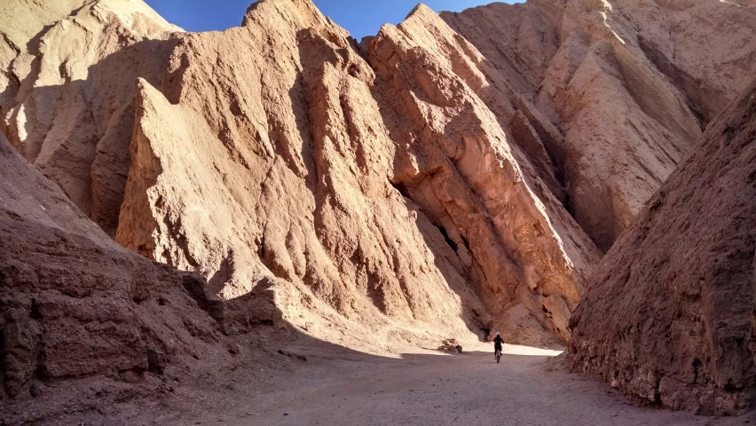 some mountains and a person in the dirt