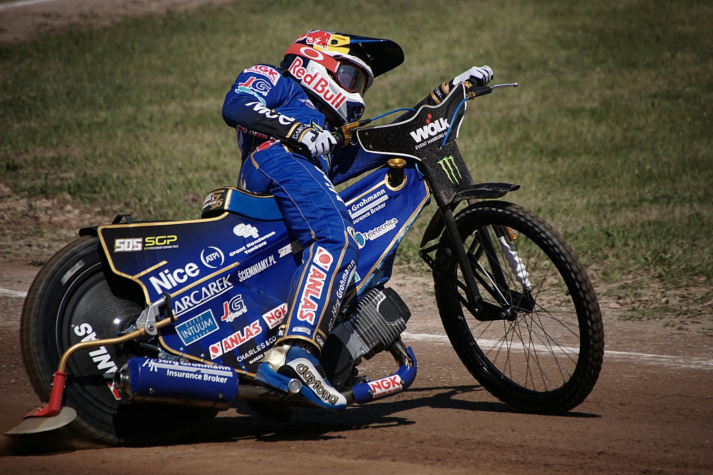 a racer riding his motorcycle around a track