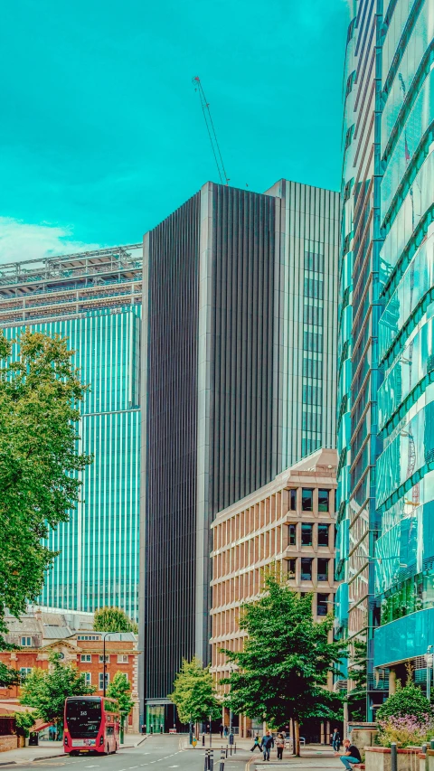 several tall buildings with windows near a street