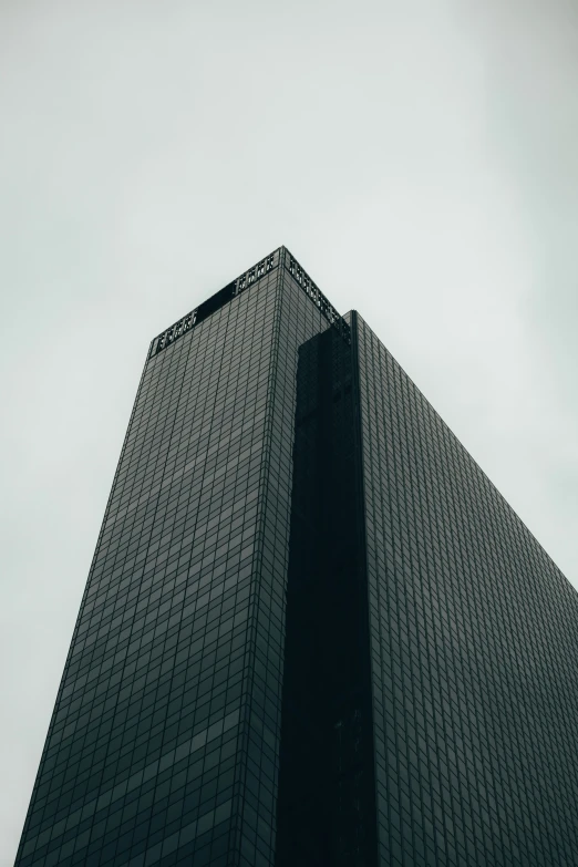 the top of the building is seen from below