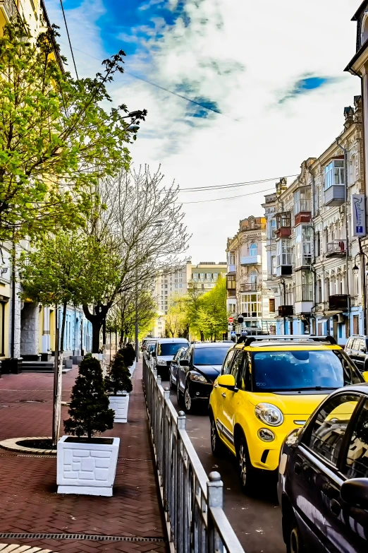 several cars parked in front of some buildings