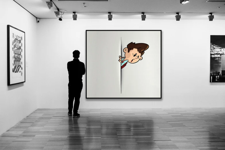 a person looking at two paintings hanging on the wall