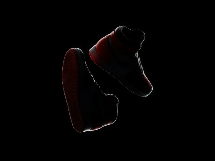 a pair of shoes on a black background