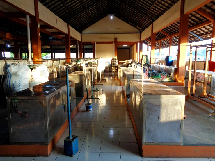 a restaurant with large white counter tops filled with food