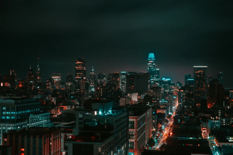 a cityscape lit up with neon lights at night