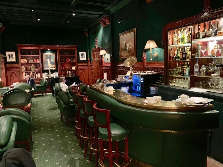 a bar is illuminated by several wooden shelves