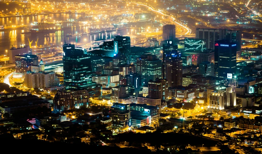 a cityscape lit up at night with very bright lights