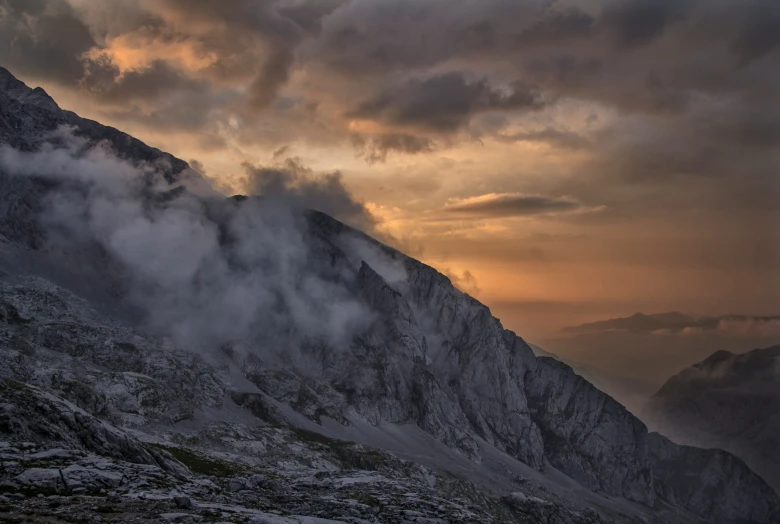 mountain range covered in clouds on a cloudy day