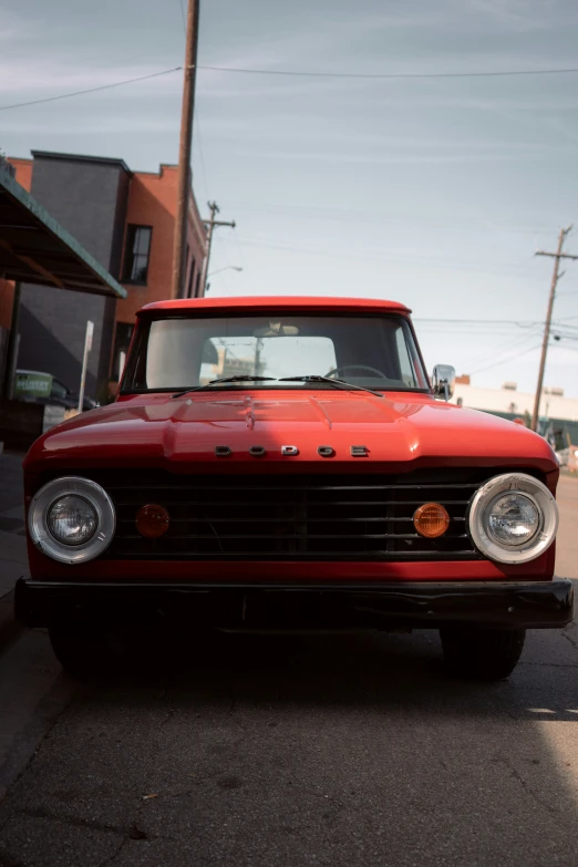 this is a red truck parked on the street