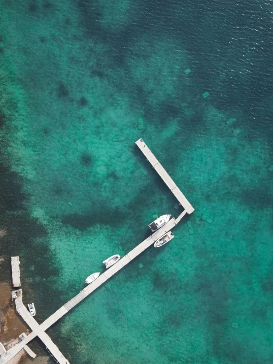 aerial s of a pier and blue water