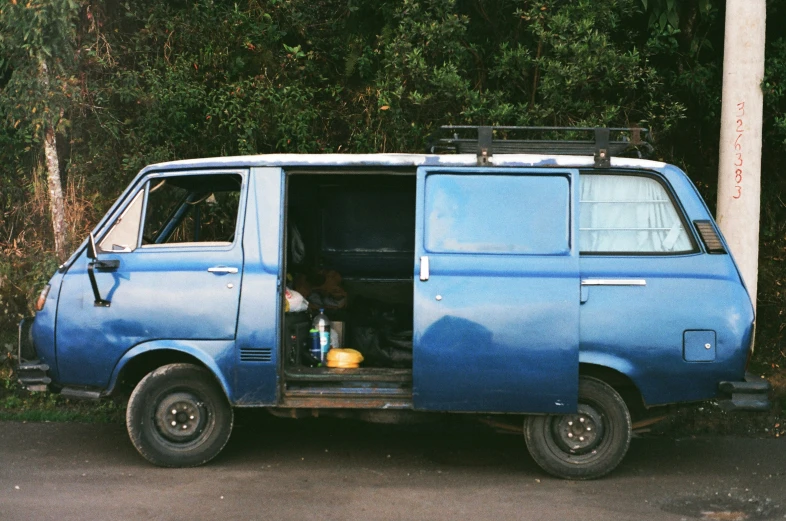 the van has a trunk full of things on it