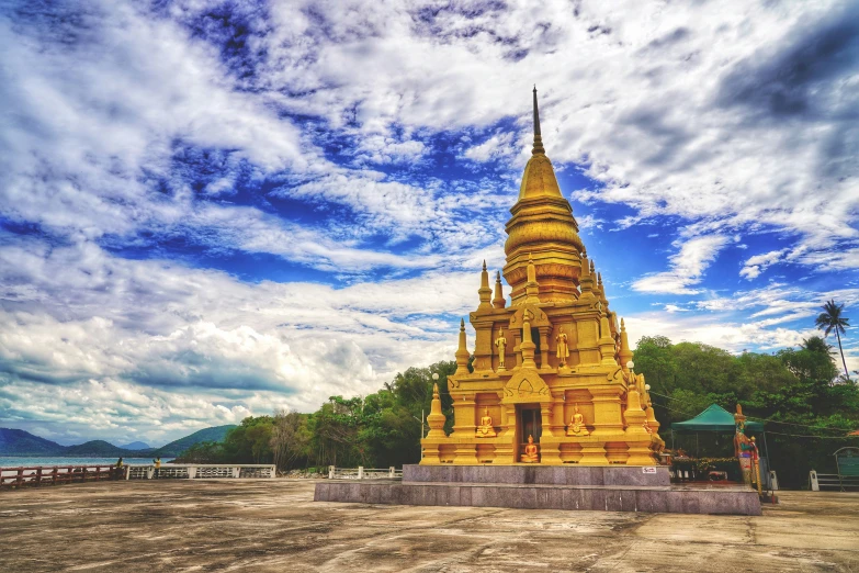 a large yellow temple with a clock tower