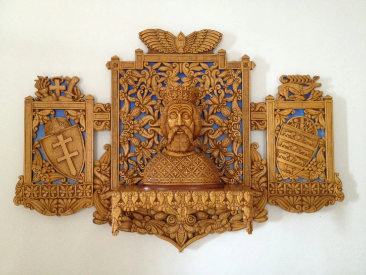 a wooden carved wall decoration in a white background