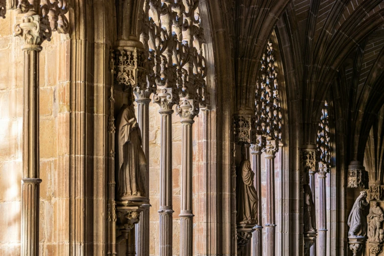 a large cathedral filled with tall columns and statues