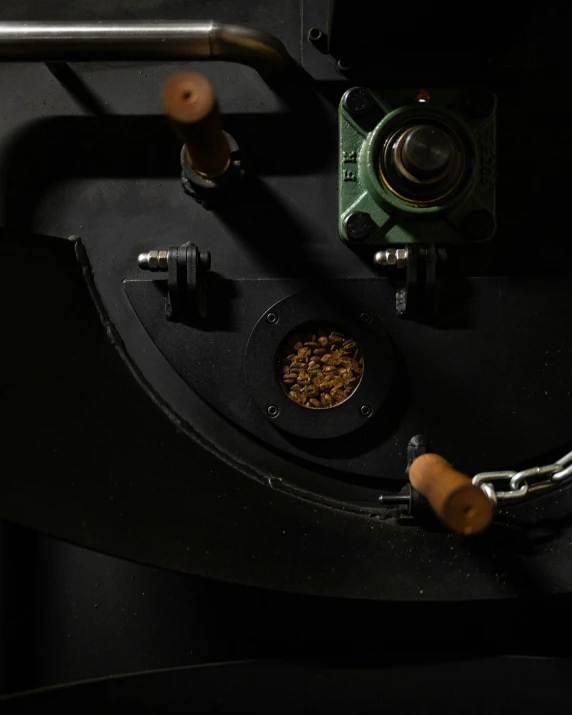 two bowls on top of black surface with a metal bar around them