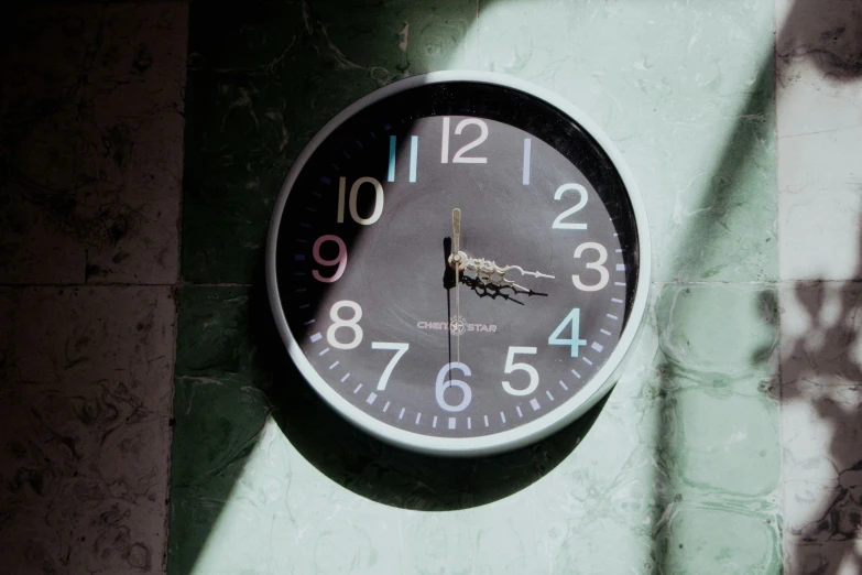 a clock on the wall displaying 5 25 with numbers