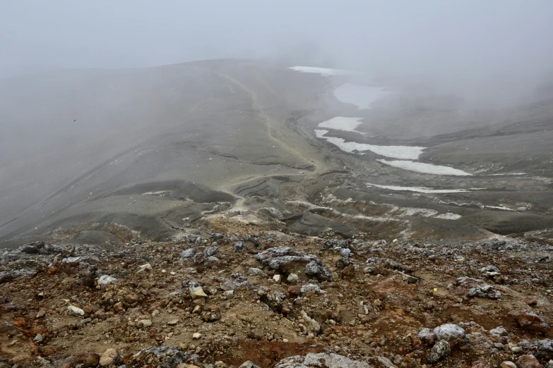 a hill that is covered with snow with two different sides covered in snow