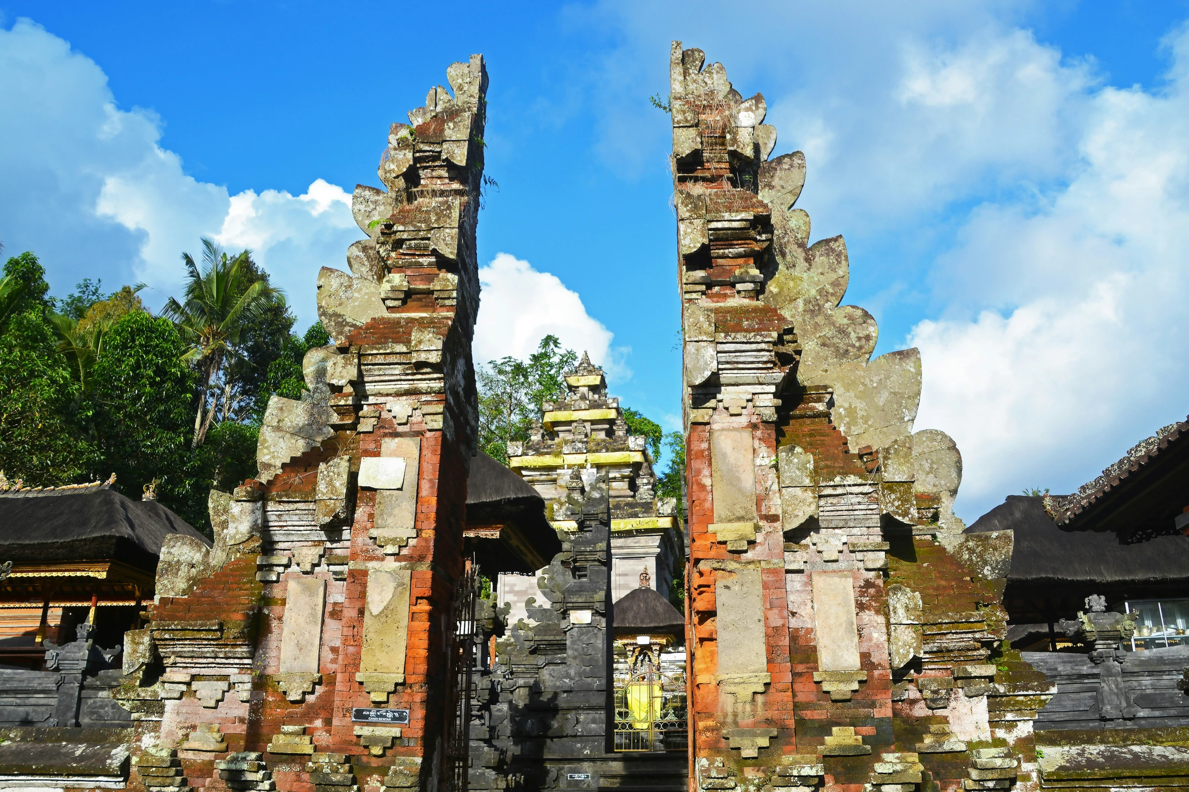 the stone gate in front of the building has two doors