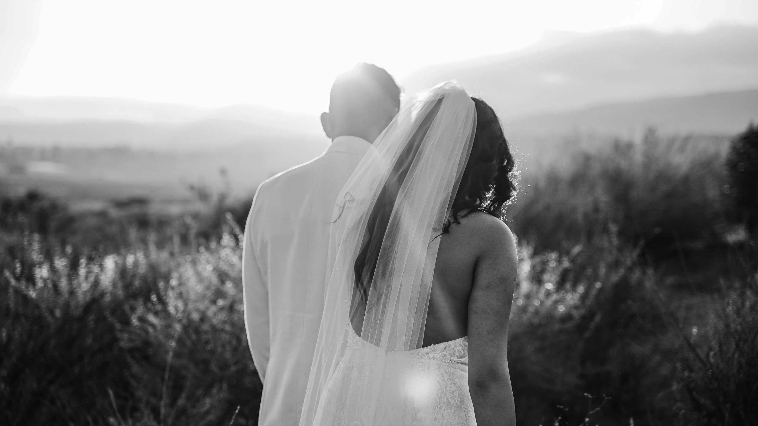 the bride and groom are standing close to each other